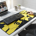 Fans Geek Store Pikachu XXL gaming mouse pad with yellow and black Pokémon design on a desk with keyboard and mouse