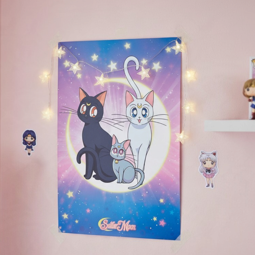 Fans Geek Store Sailor Moon poster featuring Luna, Artemis, and Diana cats on a starry purple and blue background.