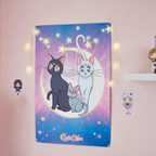 Fans Geek Store Sailor Moon poster featuring Luna, Artemis, and Diana cats on a starry purple and blue background.