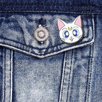 Fans Geek Store Sailor Moon Artemis metal pin attached to a blue denim jacket pocket