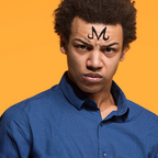 Fans Geek Store temporary Dragon Ball Majin M tattoo on a young man's forehead against a bright yellow background