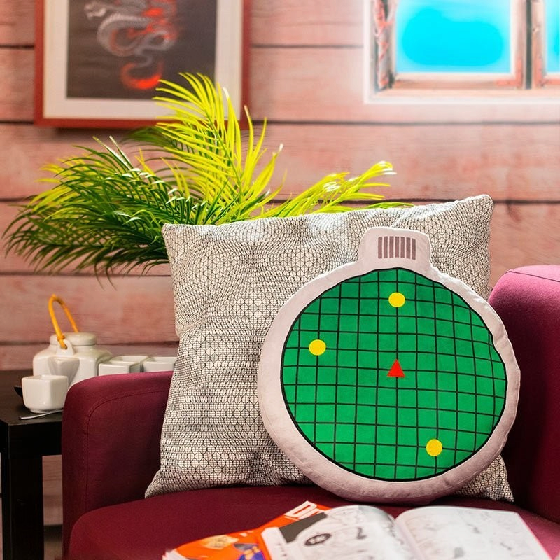 Fans Geek Store Dragon Ball radar plush cushion with sound effect and green grid design on a purple sofa