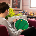 Fans Geek Store Dragon Ball radar plush pillow with sound effect held by a fan in a cozy anime-themed living room