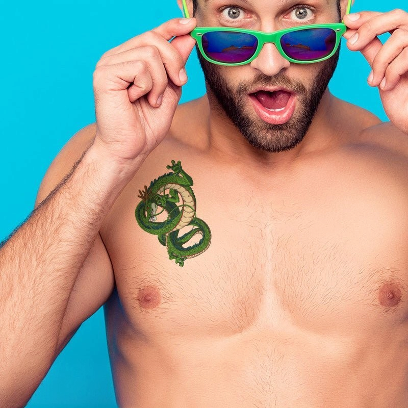 Fans Geek Store temporary Dragon Ball Shenron tattoo applied to a man's chest against a bright blue background