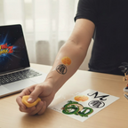 Fans Geek Store Dragon Ball temporary tattoos applied to a person's forearm, featuring iconic anime symbols.