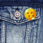 Fans Geek Store metal Dragon Ball four-star pin attached to a blue denim jacket pocket