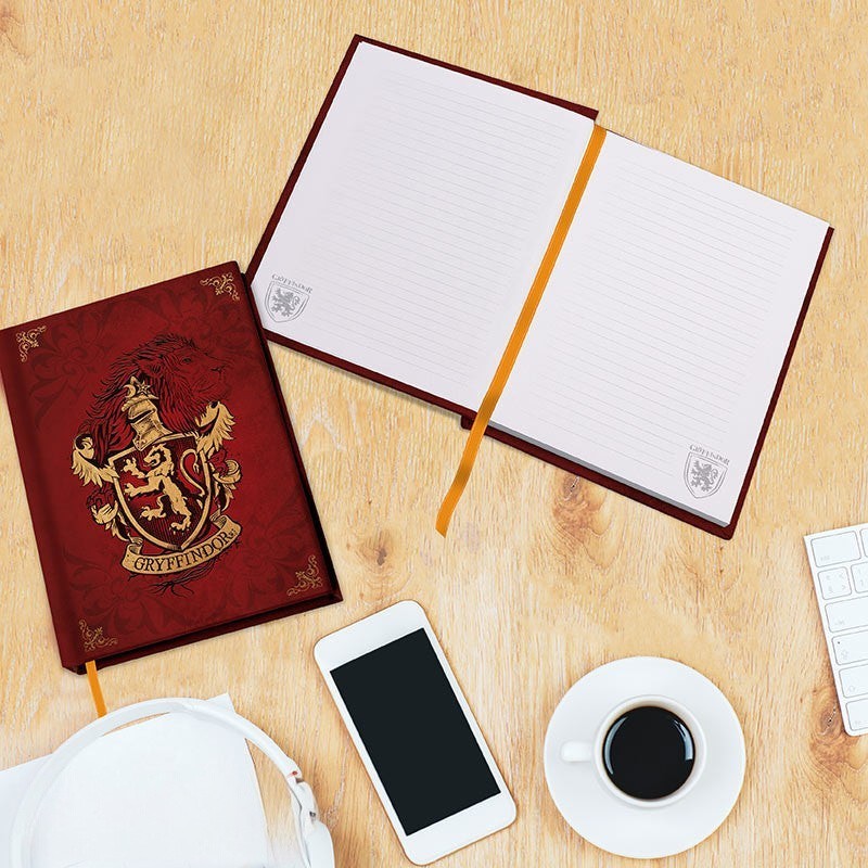Fans Geek Store Harry Potter Gryffindor A5 hardcover notebook with gold foil crest, ribbon marker, and lined pages.