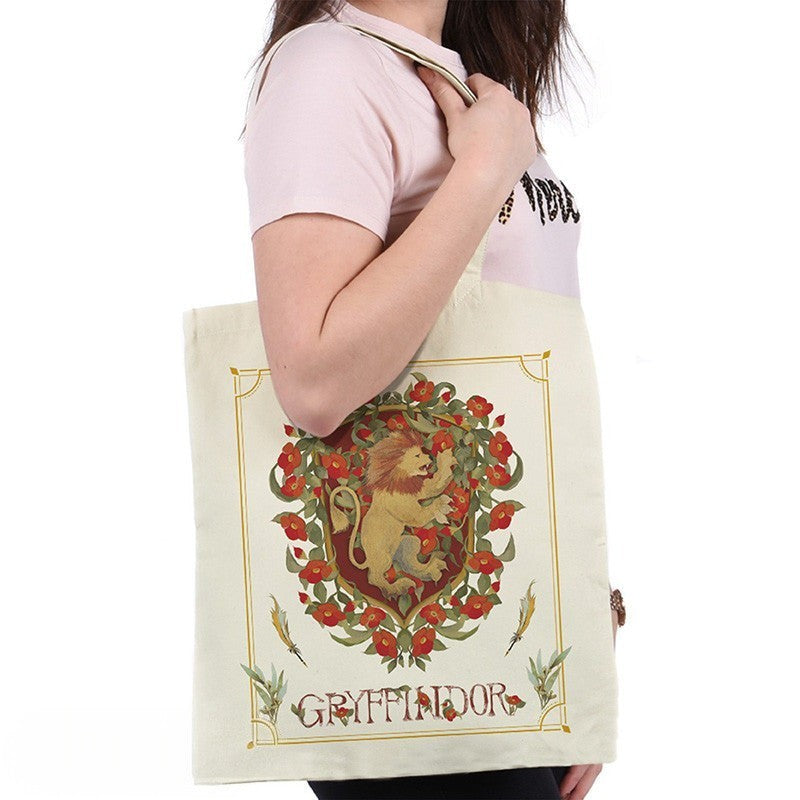 Fans Geek Store Harry Potter Gryffindor cotton tote bag with lion crest design worn over the shoulder