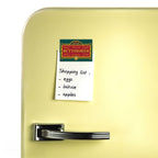 Fans Geek Store Harry Potter Butterbeer magnet with matte finish holding a shopping list on a yellow refrigerator