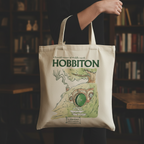 Fans Geek Store beige cotton tote bag featuring a Hobbiton illustration from The Lord of the Rings
