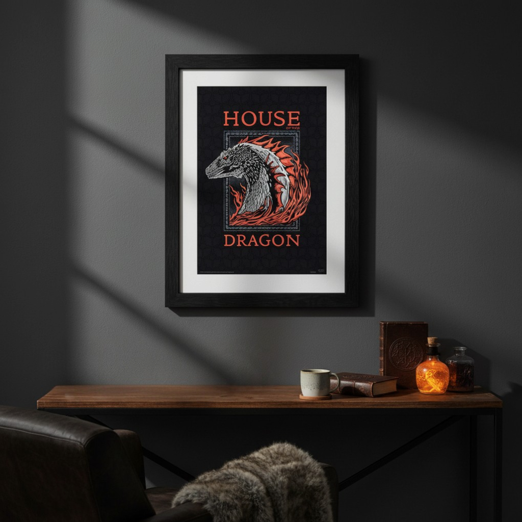 Fans Geek Store House of the Dragon red dragon poster in a black frame hanging on a dark grey wall above a desk.