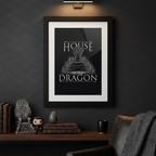 Fans Geek Store framed House of the Dragon Iron Throne poster hanging on a dark wall above a desk with collectibles.