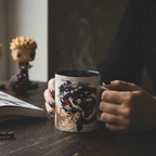 Fans Geek Store Jujutsu Kaisen ceramic mug featuring Tokyo and Kyoto sorcerers, held in hands with steam rising.