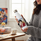 Fans Geek Store white stainless steel One Piece Luffy thermos bottle held by a woman in a cozy room