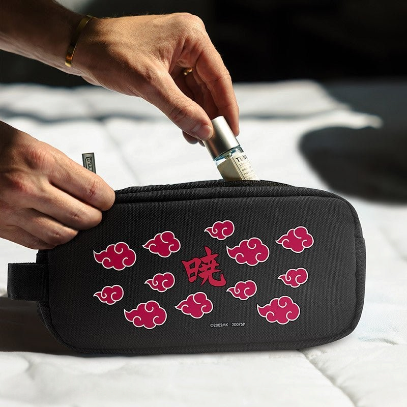 Fans Geek Store Naruto Shippuden Akatsuki pencil case with red cloud pattern being filled with a small bottle