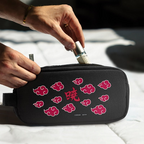 Fans Geek Store Naruto Shippuden Akatsuki pencil case with red cloud pattern being filled with a small bottle