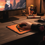 Fans Geek Store Naruto Shippuden Konoha mousepad with orange emblem on a wooden desk with a gaming setup