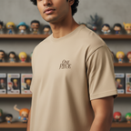 Fans Geek Store sand-colored One Piece cotton t-shirt with small logo on chest worn by a man in an anime room