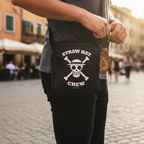 Fans Geek Store black One Piece shoulder bag featuring the white Straw Hat Skull logo worn by a person outdoors