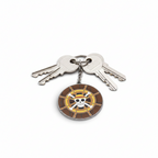 Fans Geek Store One Piece Thousand Sunny metal keychain featuring a rotating ship steering wheel with Jolly Roger
