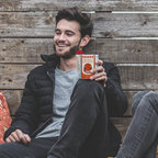 Fans Geek Store ceramic mug featuring Charmander with a 3D Pokéball handle held by a smiling man