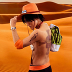 Fans Geek Store Portgas D. Ace cosplay hat with signature orange colour, red beads, and badges in a desert setting