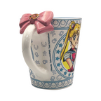 Fans Geek Store ceramic Sailor Moon mug featuring a 3D pink bow handle and Luna character design