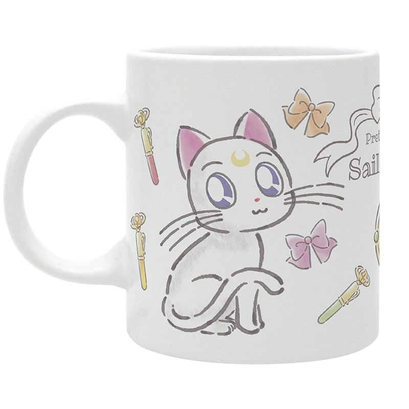 Fans Geek Store white ceramic mug featuring a chibi-style Artemis cat from Sailor Moon with magical wands and bows