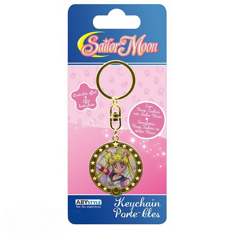 Fans Geek Store Sailor Moon lenticular keychain featuring Usagi Tsukino transforming into Sailor Moon in a gold frame.