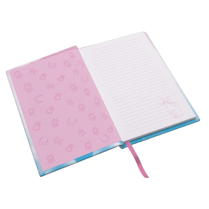 Fans Geek Store Sailor Moon A5 notebook open showing lined pages with Luna illustration and pink patterned endpapers
