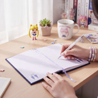 Fans Geek Store Sailor Moon A5 notebook with Luna and Artemis design, featuring lined pages and a purple ribbon marker.