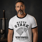 Fans Geek Store white Game of Thrones House Stark raglan t-shirt worn by a man with a sword in the background