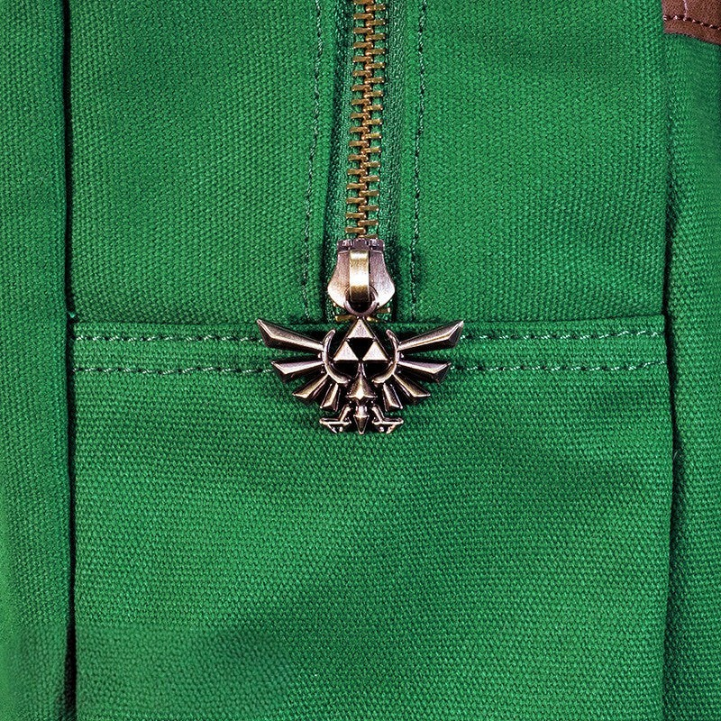 Fans Geek Store The Legend of Zelda backpack featuring a green polyester fabric and a metallic Hylian Crest zipper