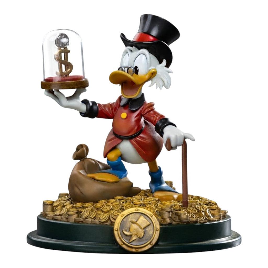 Iron Studios Uncle Scrooge McDuck statue, 17cm, hand-painted polystone, holding dollar coin under glass dome, standing on gold coins and money bag.