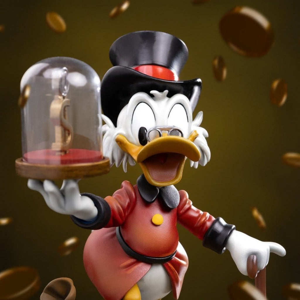 Iron Studios Uncle Scrooge McDuck statue, 17cm, hand-painted polystone, holding a dollar sign under glass.