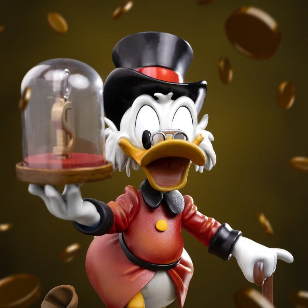 Iron Studios Uncle Scrooge McDuck statue, 17cm, hand-painted polystone, holding a dollar sign under glass.