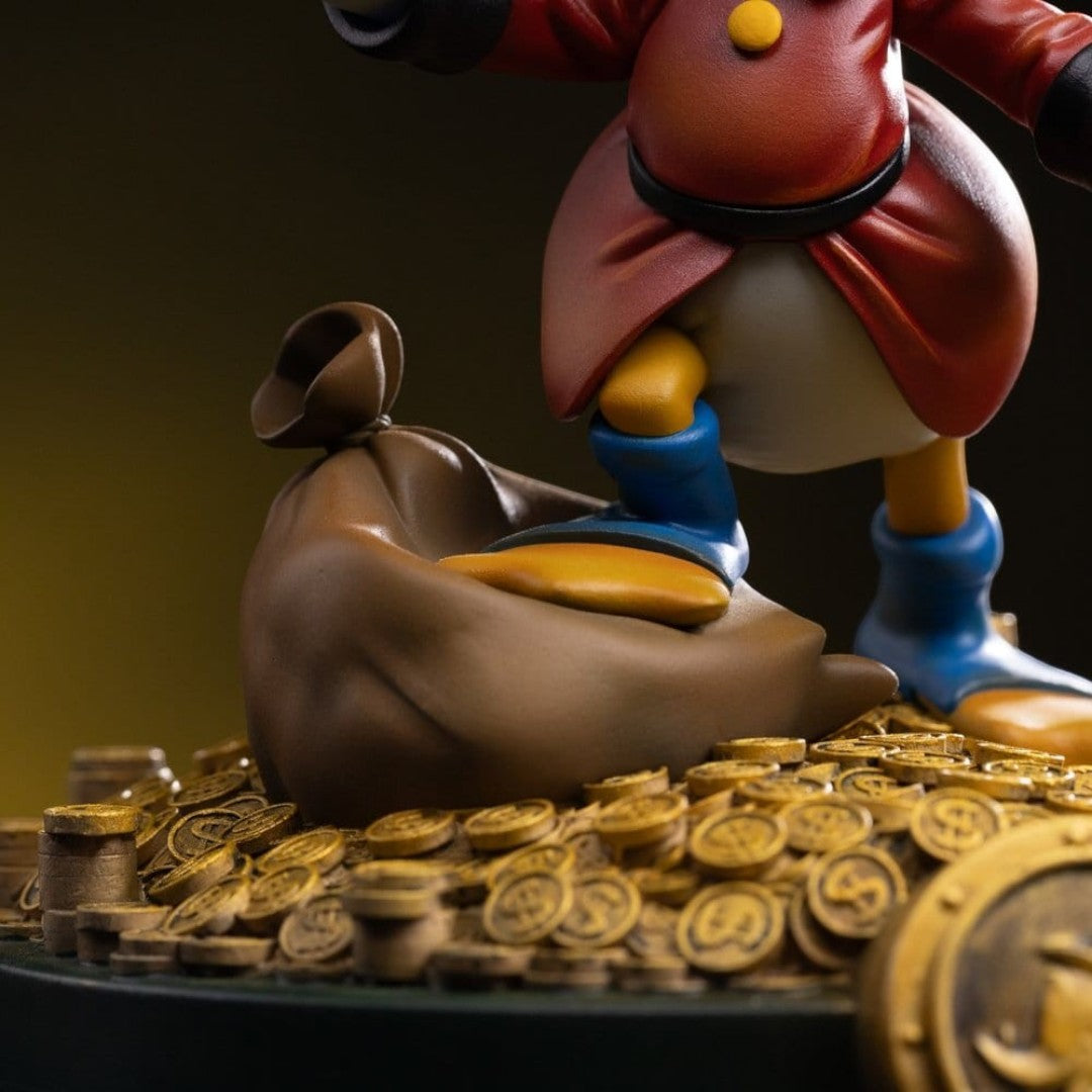 Iron Studios Uncle Scrooge McDuck statue, 17cm, hand-painted polystone, with money bag and gold coins.