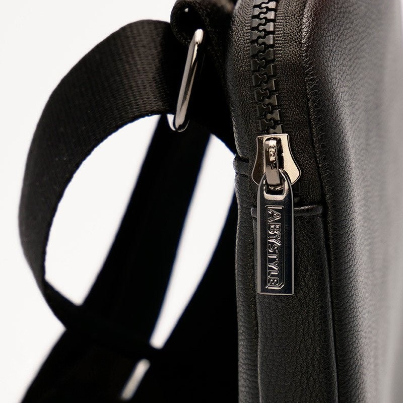 Fans Geek Store One Piece shoulder bag in black faux leather with a metallic zipper pull detail